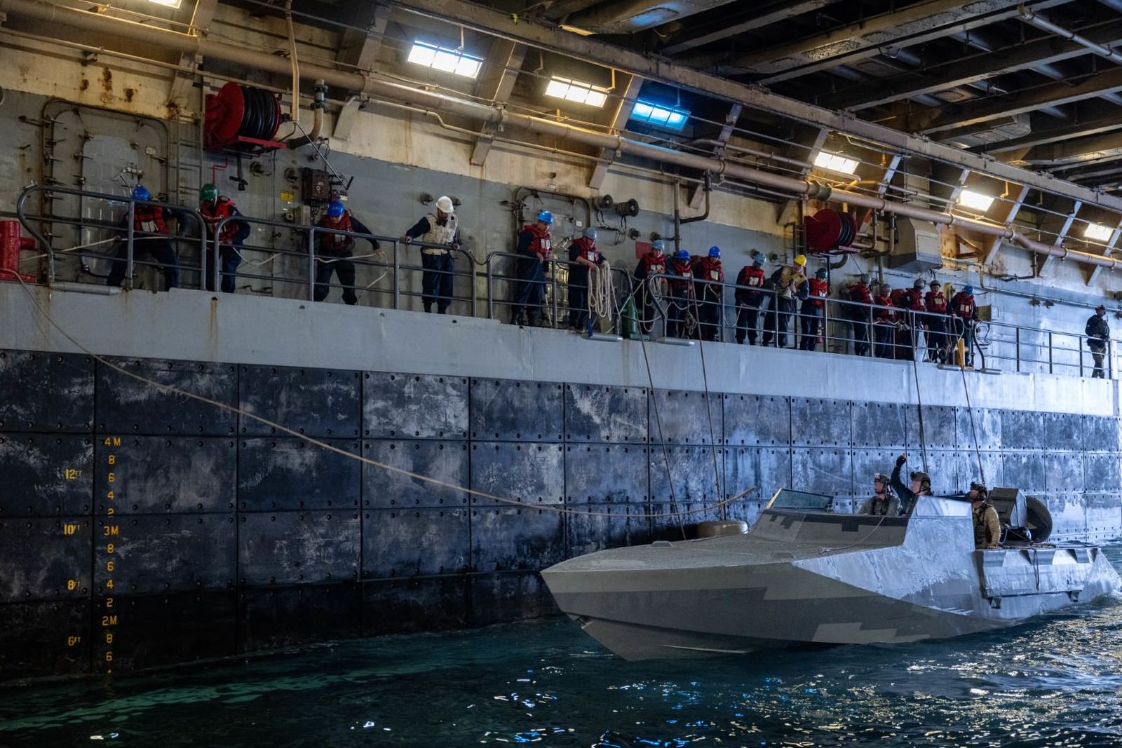 A special warfare craft in the well deck of an amphibious ship