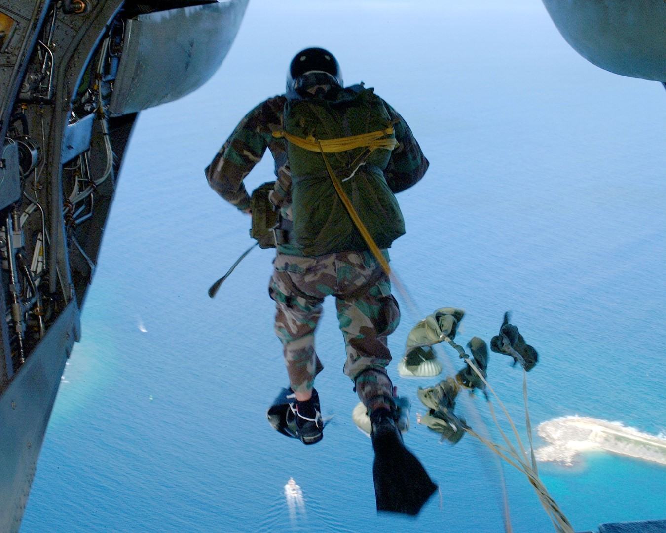 An operator conducting a parachute descent over open water
