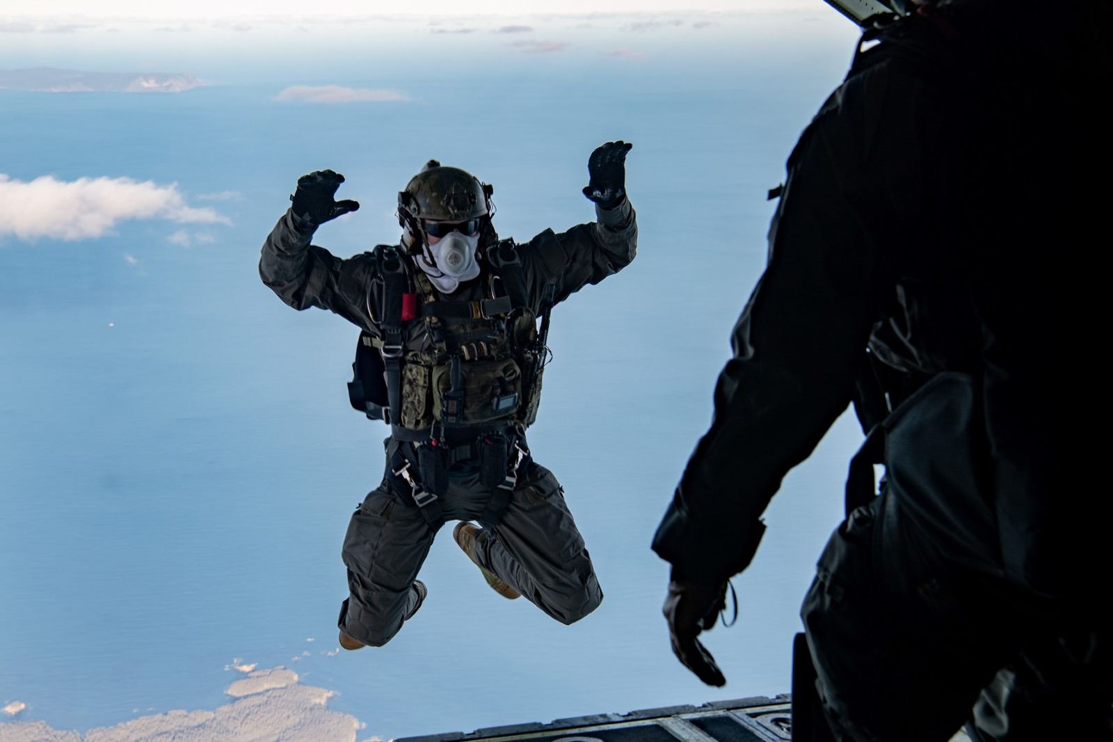 An operator exiting an aircraft into free fall