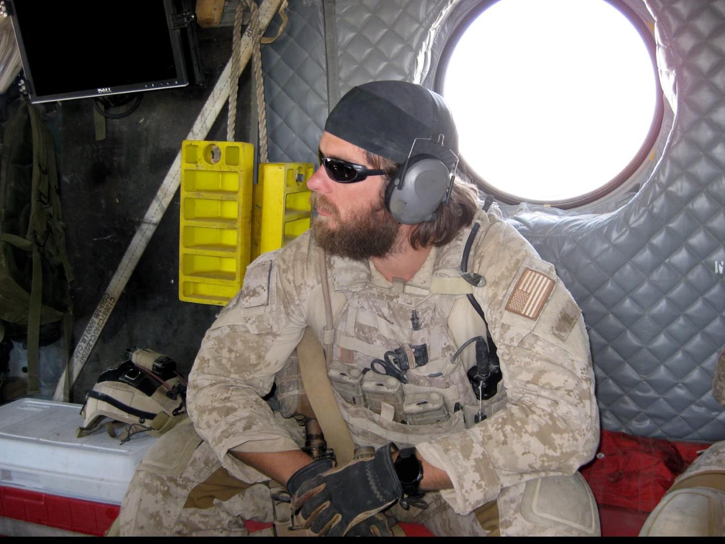 A Naval Special Warfare operator aboard a transport aircraft